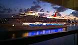 View of a Carnival Cruise Ship coming into the Port of Miami at dawn from the Norwegian Pearl.